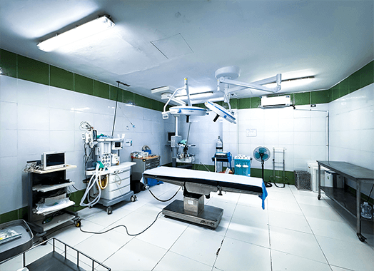 The operating theatre, set up with surgical lights, anaesthetic machine and operating table